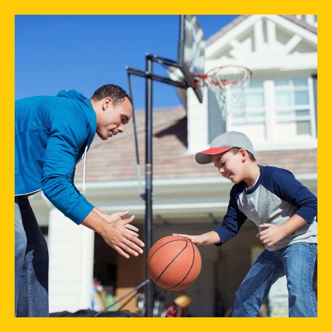 image of a father and son playing basketball